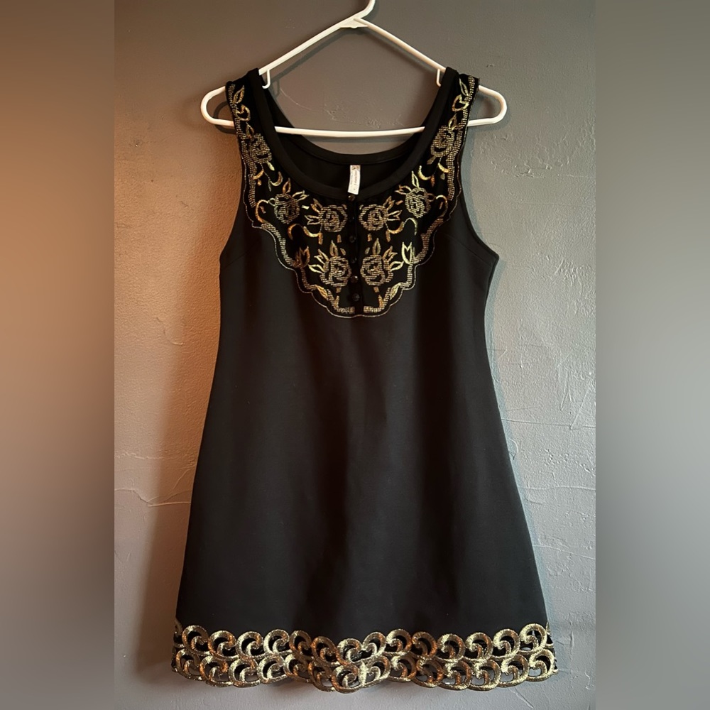 Free People black and gold loose fitting mini dress; size 6.